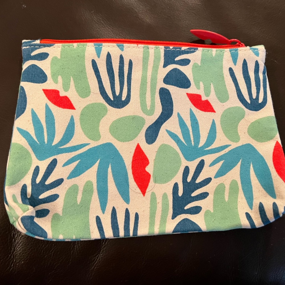 Ipsy cosmetics bag multi colored with plant like pattern